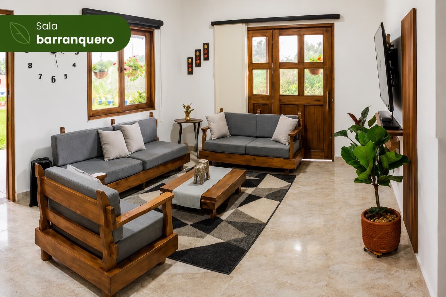 Sala de la Cabaña Barranquero con sofás y televisor